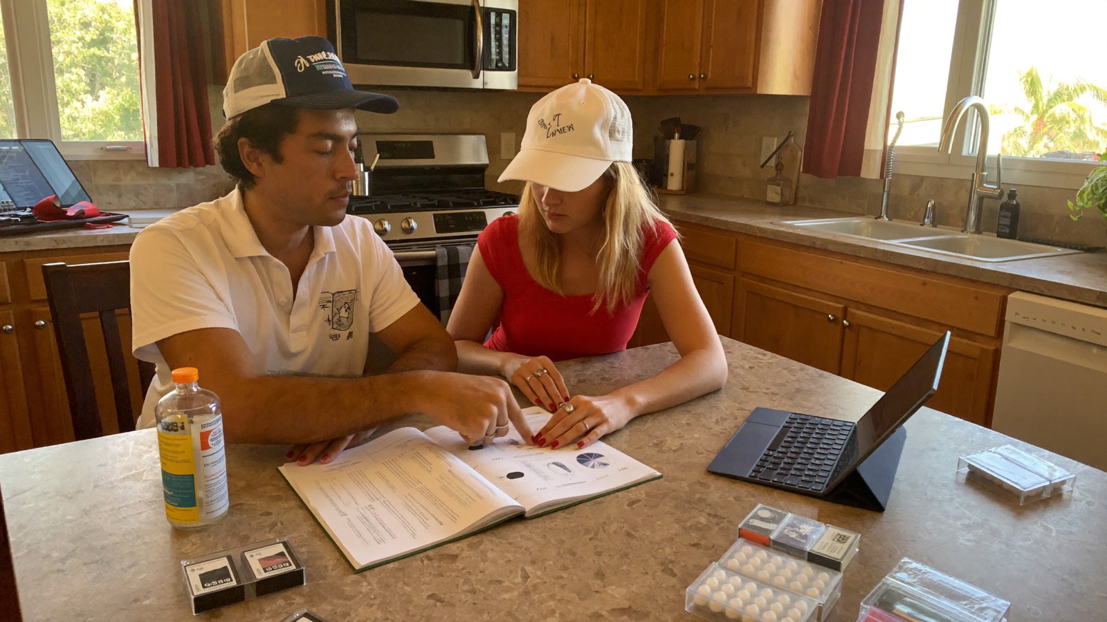 Inspector reviewing a lab mold report with a Jupiter homeowner